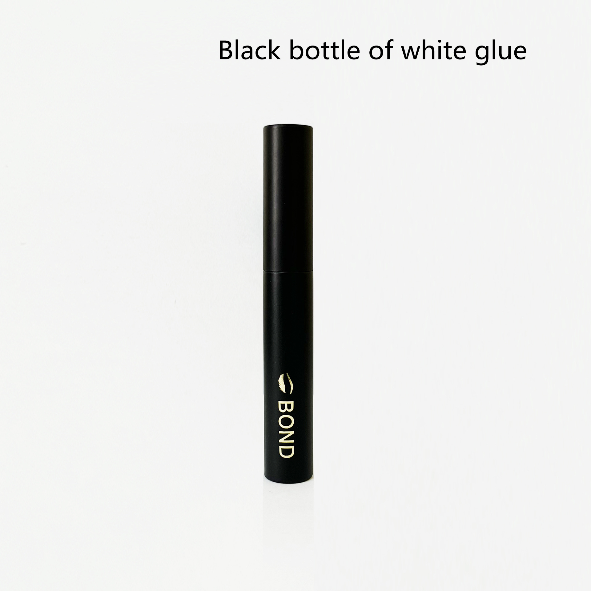 Black bottle of white glue