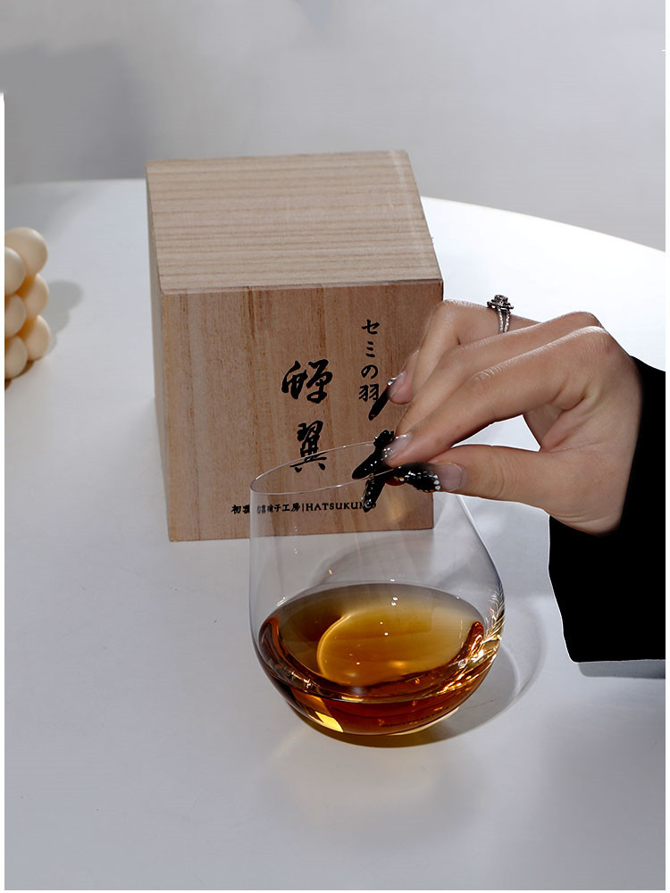 The Design Of A Thin Glass Art Wine Glass By A Tumbler