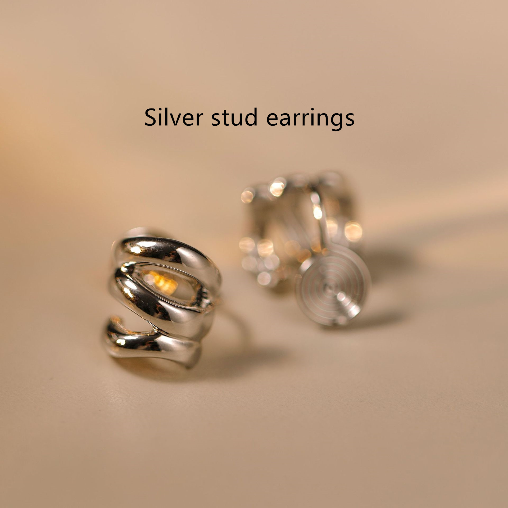 A Pair Of Silver Ear Studs