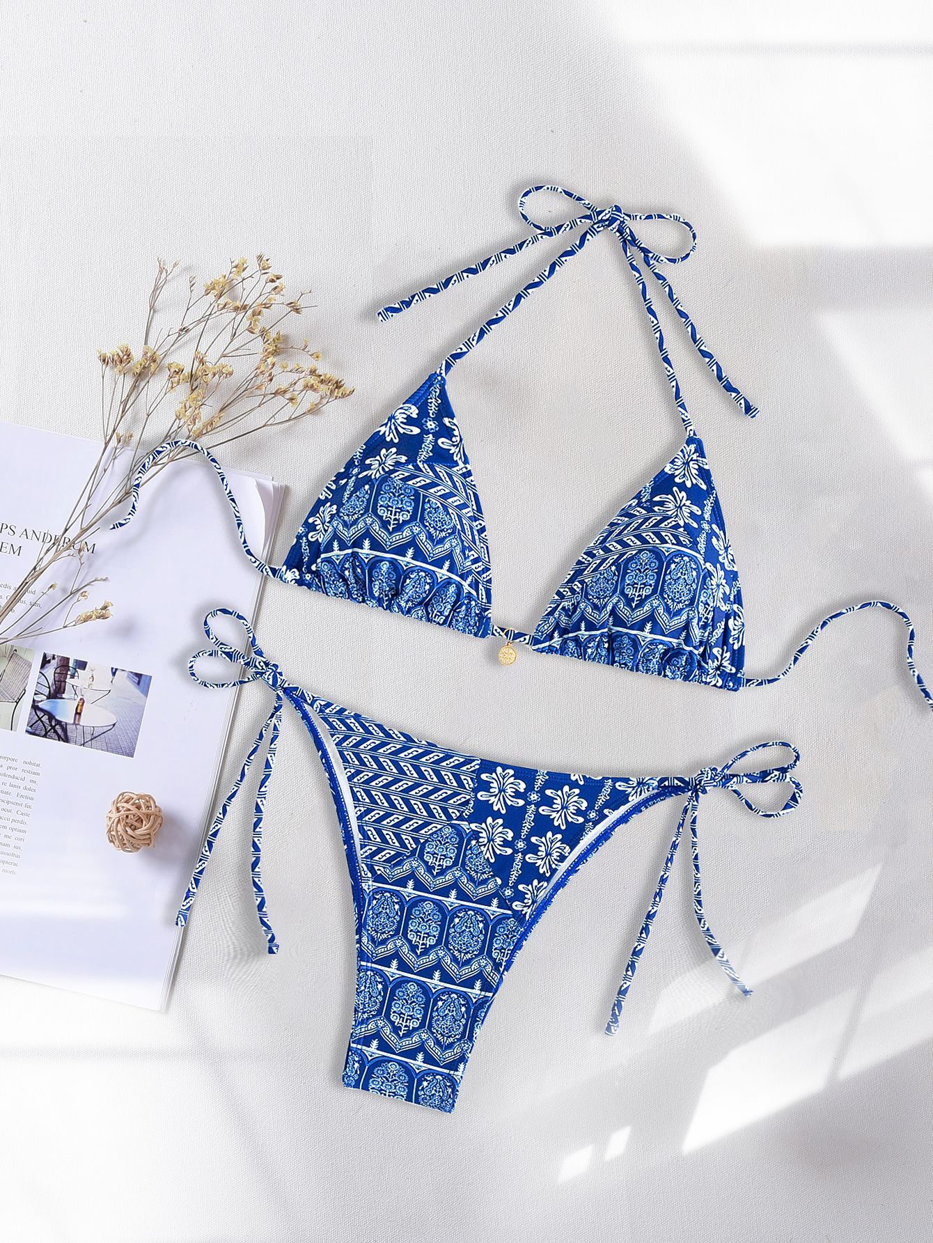 Slip into earthy elegance with our Boho Chic Printed Triangle Bikini Set—designed for beach lovers, sun seekers, and free-spirited souls.  Unique Features of This Boho Chic Printed Triangle Bikini Set Signature Boho Chic Print Featuring a unique, nature-inspired pattern that blends florals, paisleys, and tribal motifs in earthy, muted tones—perfect for bohemian, gypsy, and indie aesthetics.  Classic Triangle Top with Adjustable Fit Slide triangle bikini top offers minimal to moderate coverage with adjustable straps for the perfect customized fit every time.  Comfortable, High Quality Fabric Soft to the touch, breathable, and dries quickly—crafted for sunbathing, swimming, and lounging in comfort all day long.  Matching Tie-Side Bottoms Flattering, adjustable tie sides allow flexibility in sizing and offer a sexy yet secure fit for all body shapes.  Reversible Design Option Flip it for a second look—one side features the printed pattern, the other a solid earthy tone for mix-and-match versatility.  Benefits of the Boho Chic Printed Triangle Bikini Set Bohemian Style with a Flattering Fit Whether you're beach-bound or poolside, this set hugs and enhances your body while embracing your earthy, boho soul.  Versatile for All Summer Adventures Perfect for festivals, tropical vacations, weekend getaways, or simply basking under the sun with indie flair.  Effortlessly Chic and Instagram-Worthy A must-have for hippie-chic and free-spirited wardrobes—pair it with sheer kimonos, sarongs, or body chains for a flowy layered look.  Care Guide for Your Boho Chic Printed Triangle Bikini Set Hand wash gently in cold water with mild detergent  Do not bleach or tumble dry  Lay flat in shade to dry and preserve fabric integrity  Sizing Tips for the Boho Chic Printed Triangle Bikini Set Available in S, M, and L — check our size guide to find your best fit  If you’re between sizes, we recommend choosing the larger size—our sizing tends to run slightly small  Adjustable ties on top and bottom allow for flexibility and comfort  For extra help, feel free to email us at bohoharmony.store@gmail.com—we’re here to help with sizing and style advice  Size Guide Available for This Item—please refer before ordering to ensure a perfect fit  Why Choose This Boho Chic Printed Triangle Bikini Set? Free Worldwide Shipping  Easy Returns Within 30 Days  Caring and Friendly Customer Support Team  Let your summer style shine with bohemian charm—add this set to your beachwear collection today.  Meta Description Boho Chic Printed Triangle Bikini Set with earthy patterns, flattering adjustable fit, and high-quality fabric—perfect for bohemian summer style.