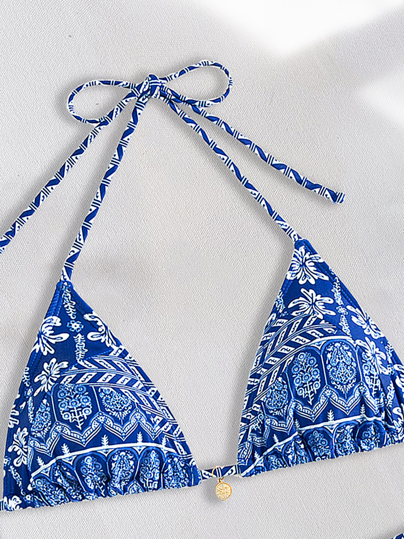 Boho Chic Printed Triangle Bikini Set with earthy patterns, flattering adjustable fit, and high-quality fabric—perfect for bohemian summer style.