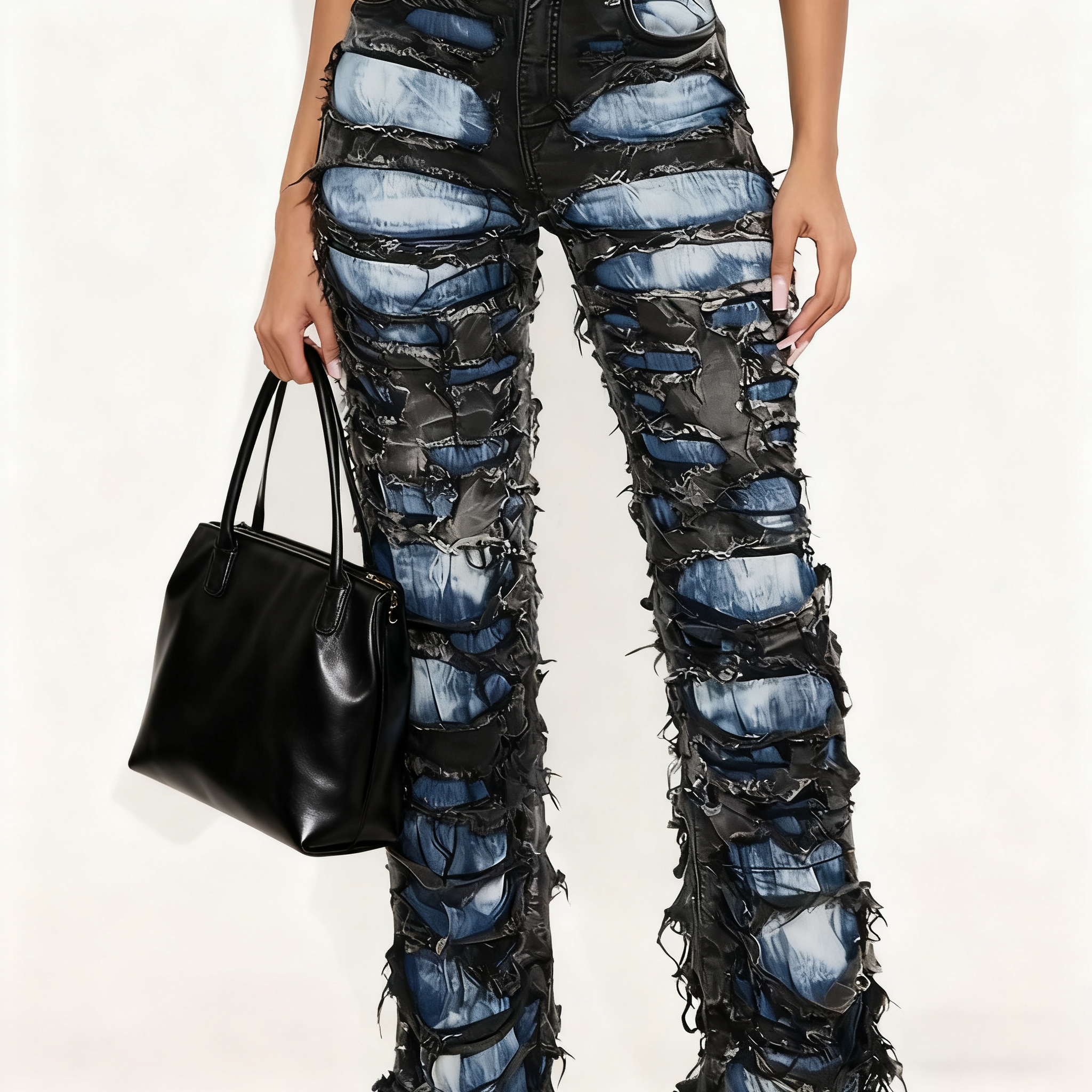 Two tone distressed wide leg jeans featuring black and blue denim with layered ripped sections.