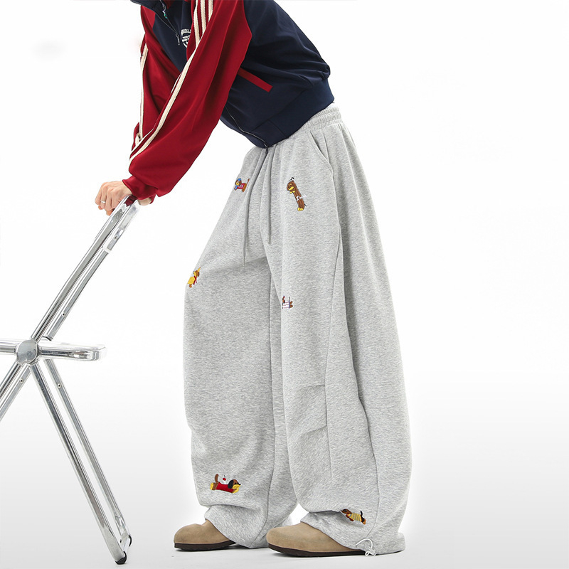 Men's dachshund embroidered sweatpants in grey – front view