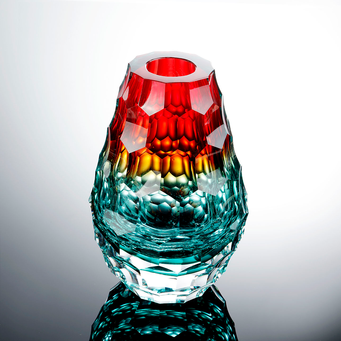 Handcrafted Artistic Glass Vase With A Weighty Recessed Facet Design