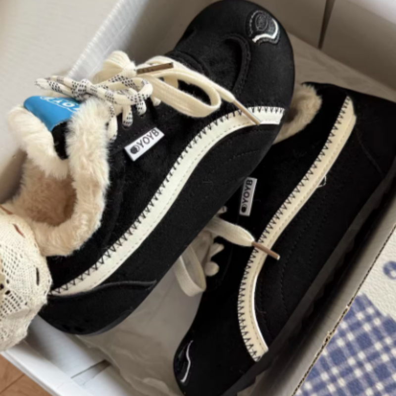 Brown Dachshund Wearing Plush Trainers