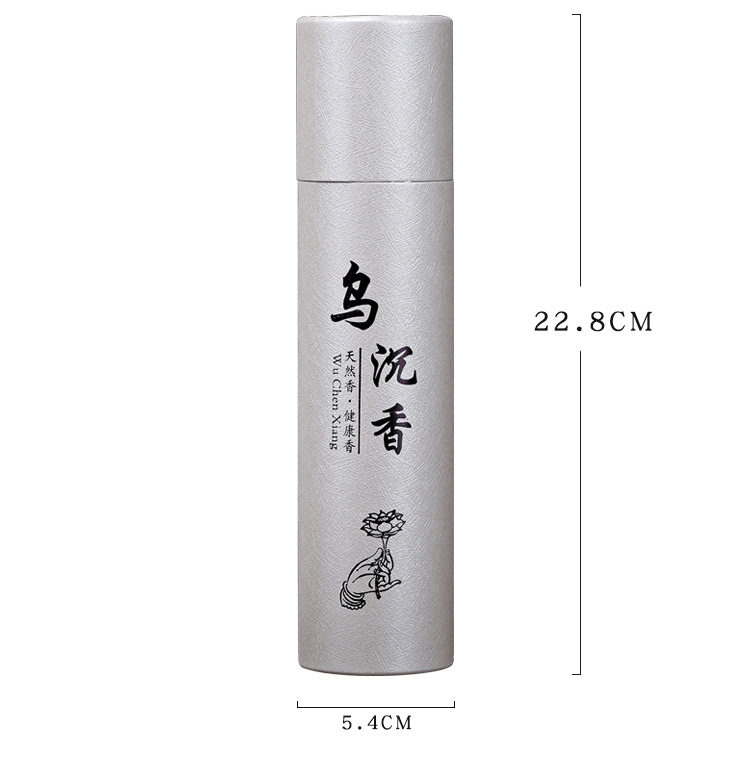 Hand holding a cylindrical beige product with text and design against a neutral background