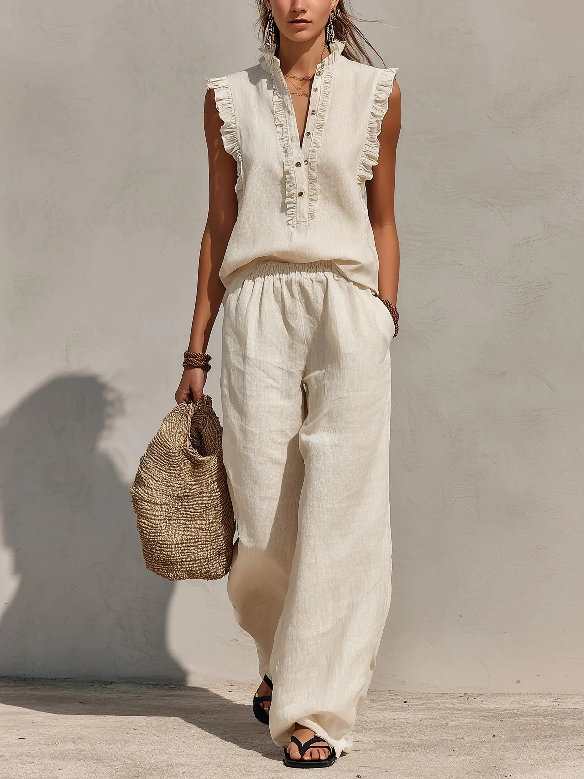 Women's ruffled V-neck tank top and wide-leg pants two-piece set in beige – front view