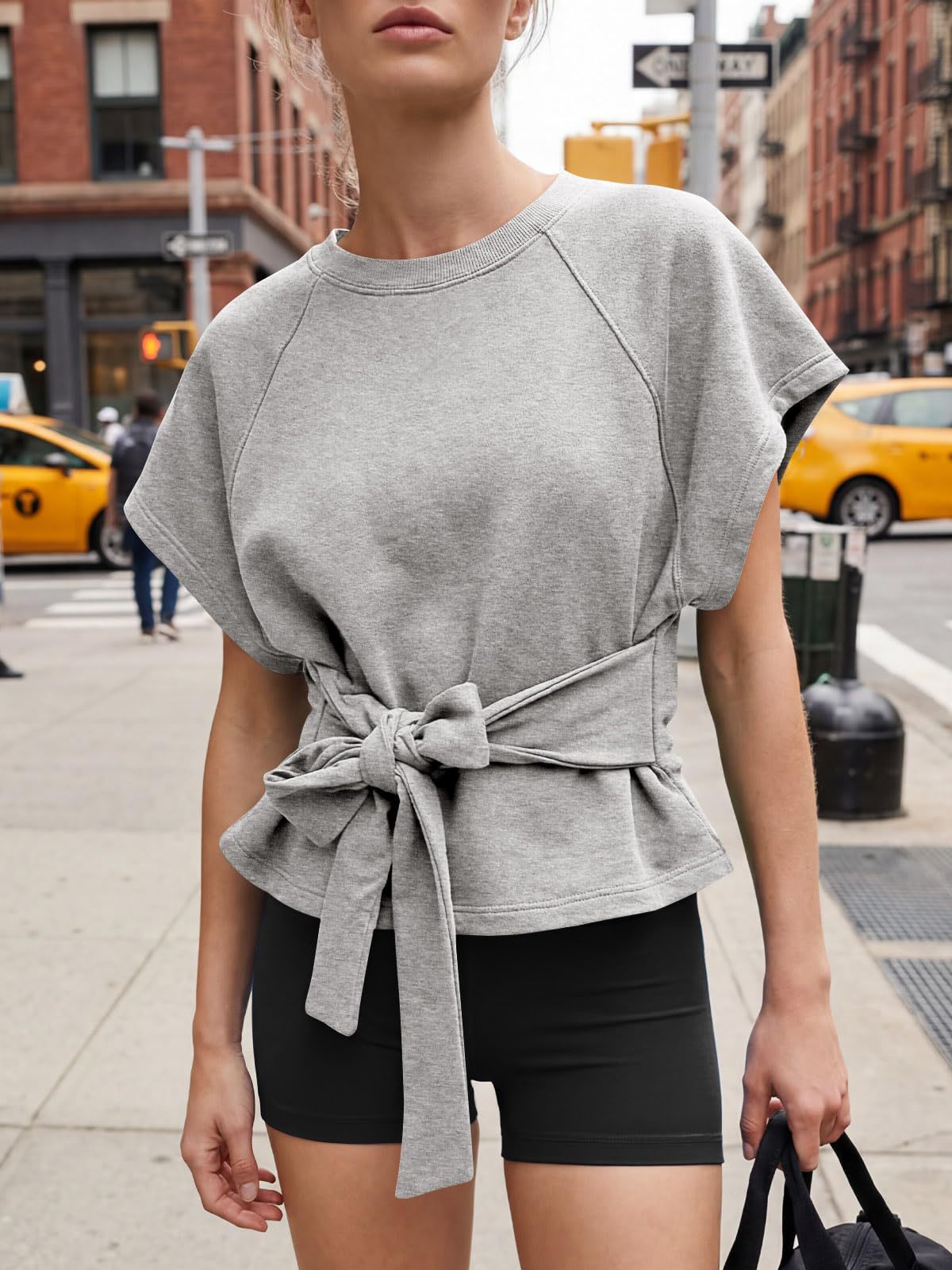 Women's bow-knot short-sleeve top in pink, full front view