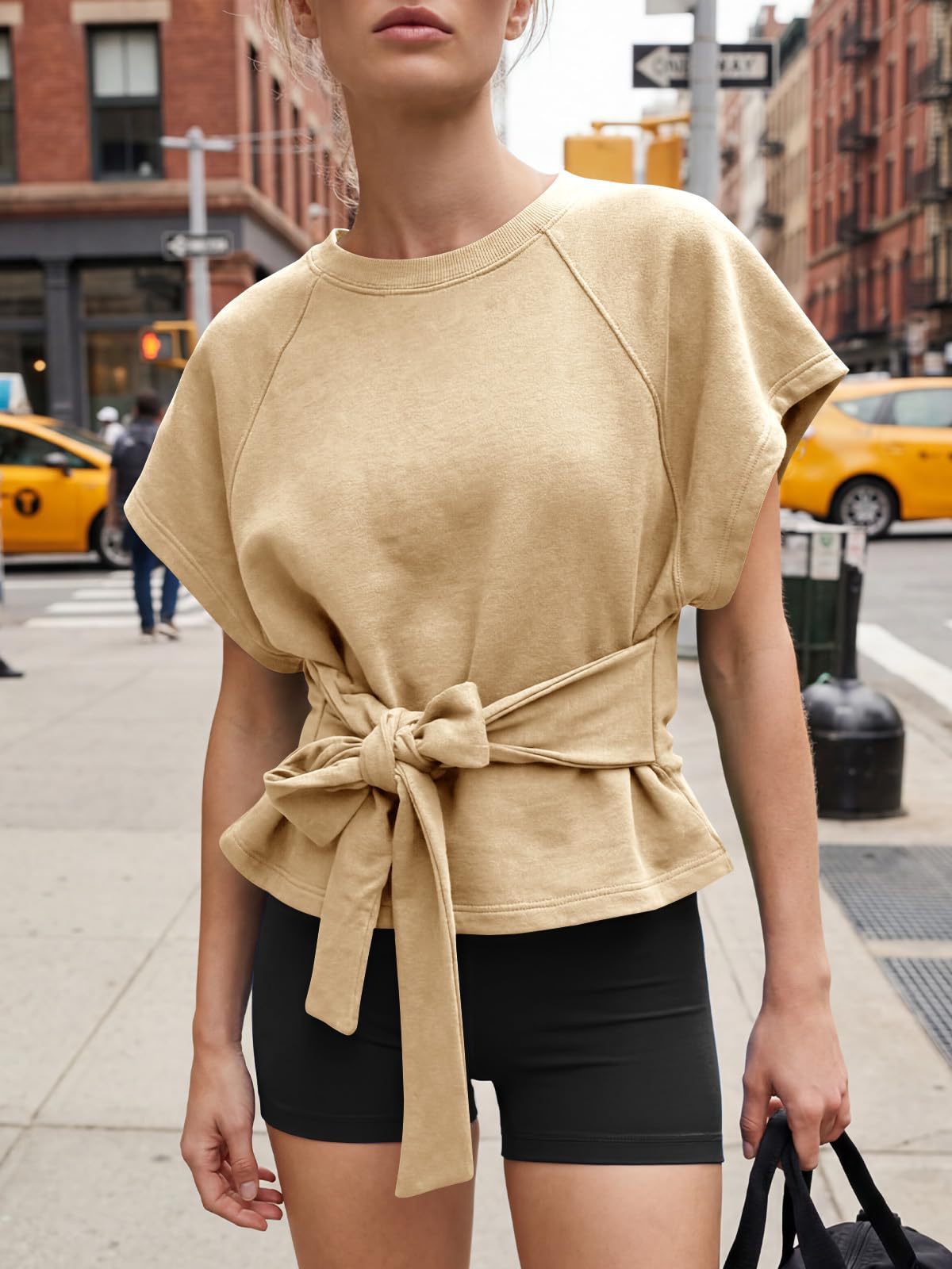 Women's loose round-neck top in green, casual summer lifestyle photo