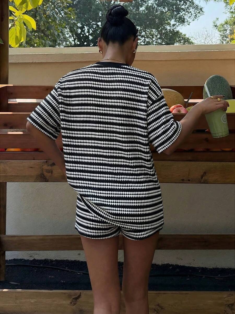 Women's matching shorts set in black, full outfit view
