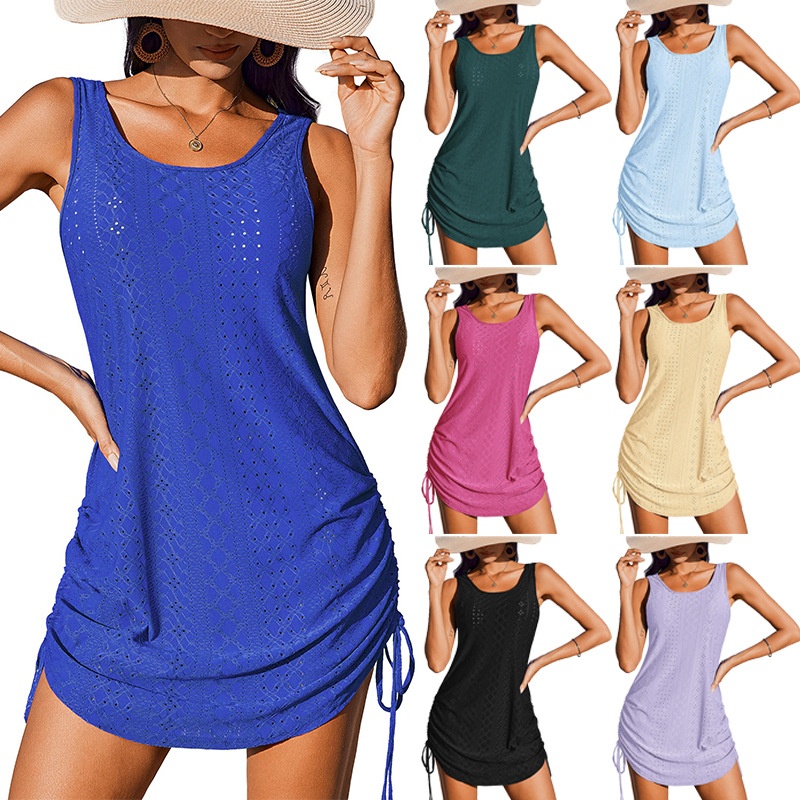 Women's hollow-out mini dress in white, front view showing full silhouette and drawstring waist detail