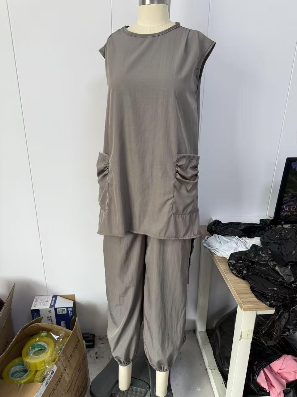 Chic casual resort set, model wearing detail shot showing top and pants co-ord