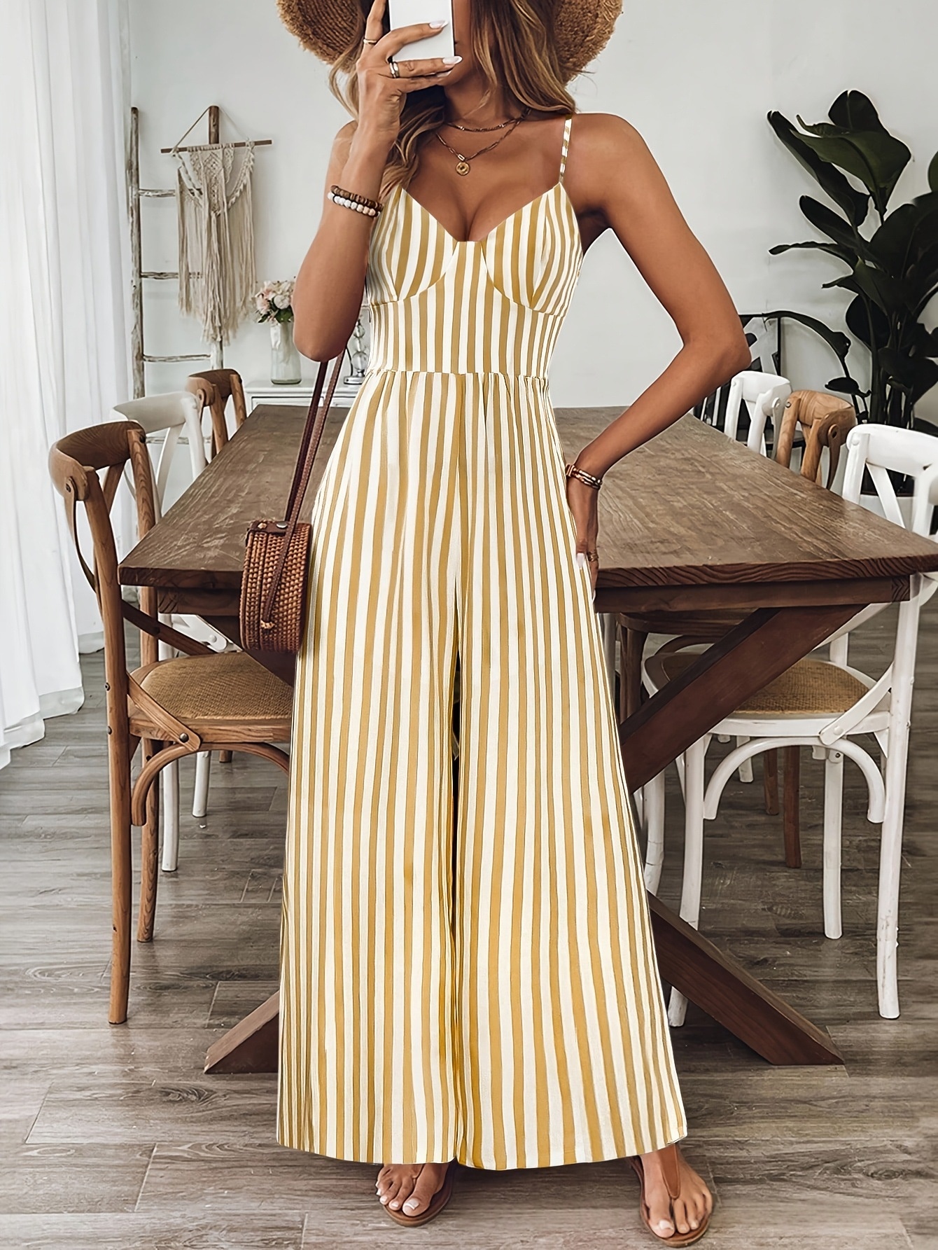 Ginger yellow strap jumpsuit, model wearing lifestyle photo showing complete vacation styling