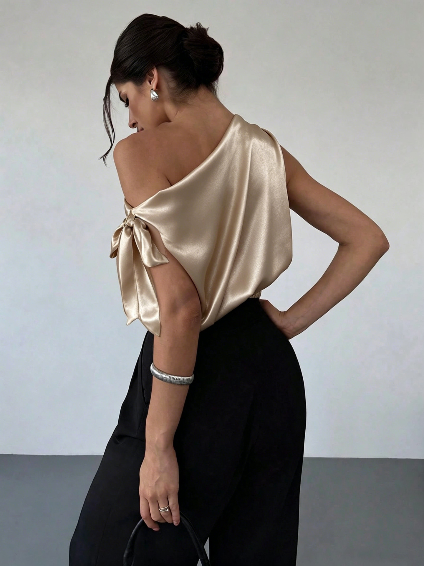 Women's satin off-shoulder asymmetrical bow blouse in all four colors – Apricot, Black, Dark Purple, White