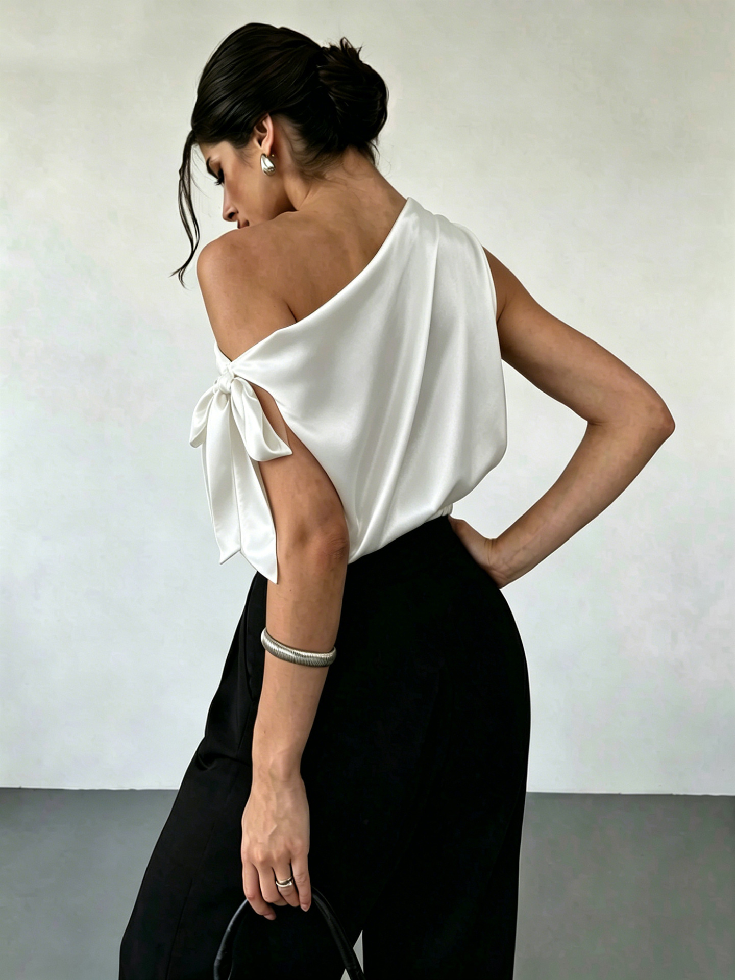 Women's satin bow blouse in Apricot – off-shoulder asymmetrical top styled for date night with trousers