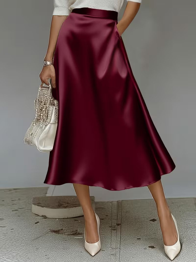Women's satin solid color skirt size fit model wearing mid-length elegant skirt