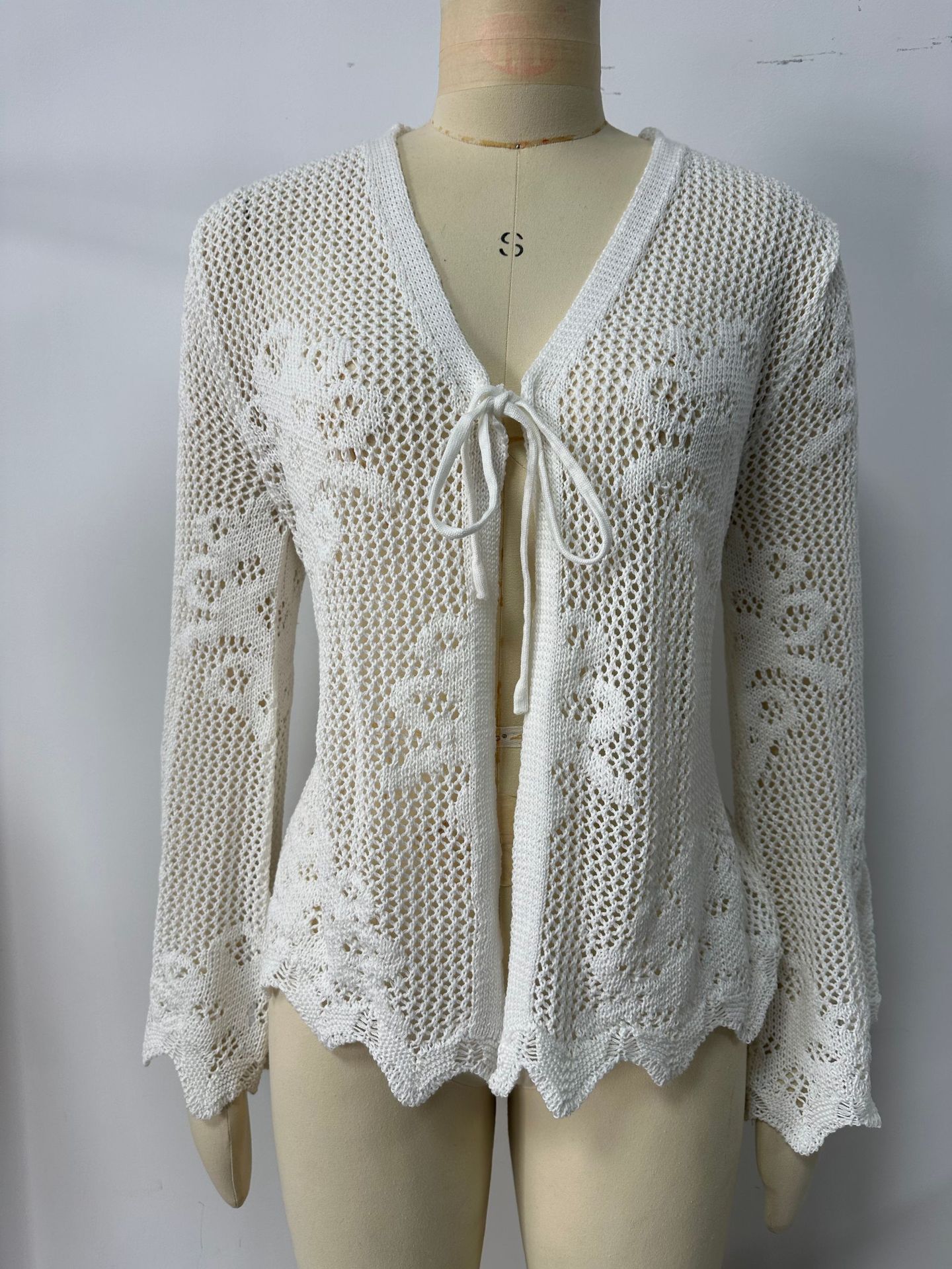 Women's open knit lace-up cardigan in Black – back detail showing hollow-out knit pattern