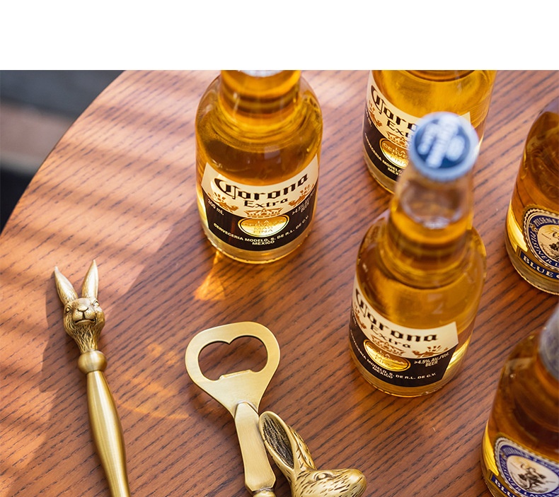 Retro brass bottle opener with rabbit and elk design