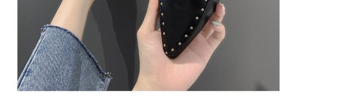 Black pointed toe mules styled with tailored trousers for office look