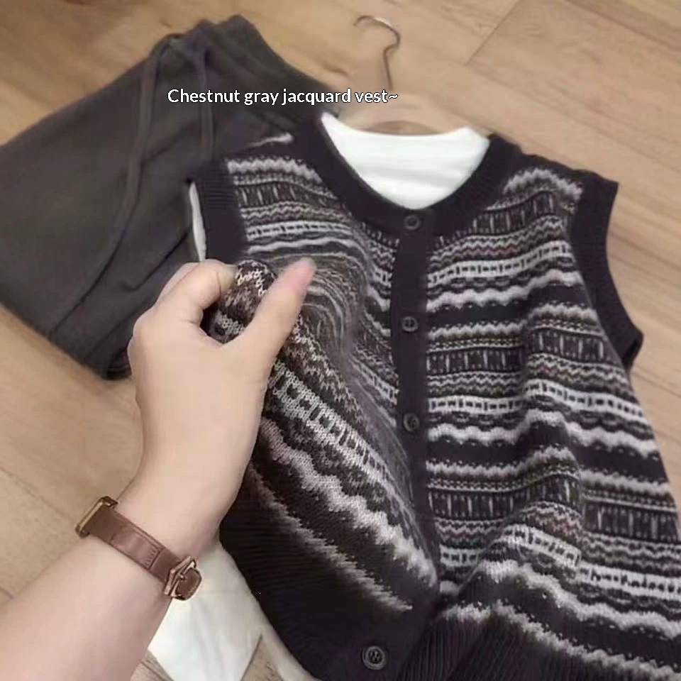 Sleeveless Sweater Layered Over A Thick Vest Or Sleeveless Waistcoat