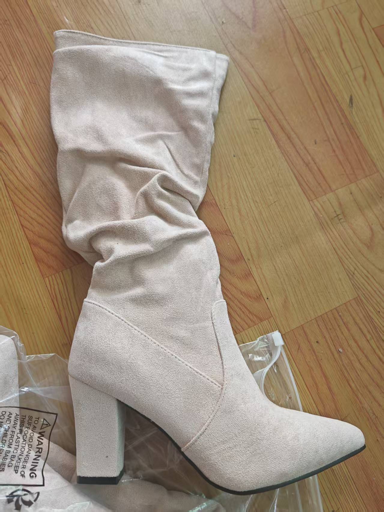 Beige suede-look slouch boot showing the pointed toe, panel seams and covered block heel